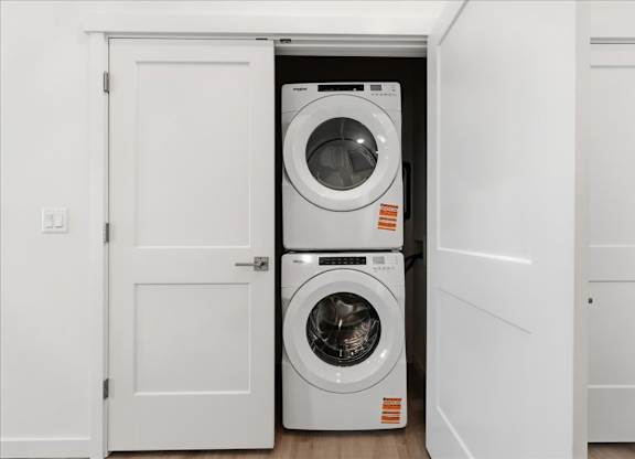 Stack of white washing machines at Alante Homes at Spring Run, Caldwell, ID, 83607