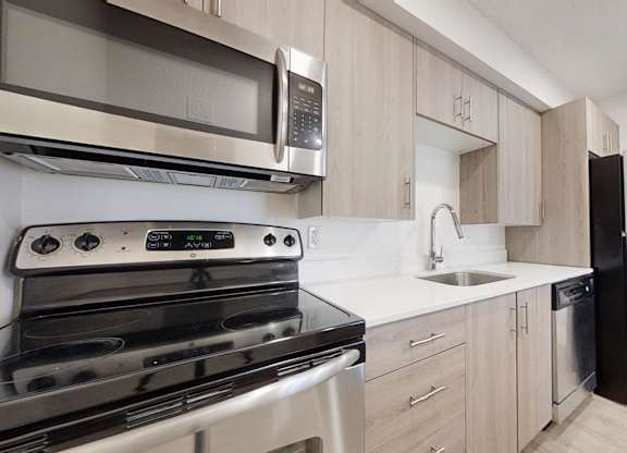 Fully Equipped Kitchen With Modern Appliances at Avia Lofts at Maple Road, Amherst, New York