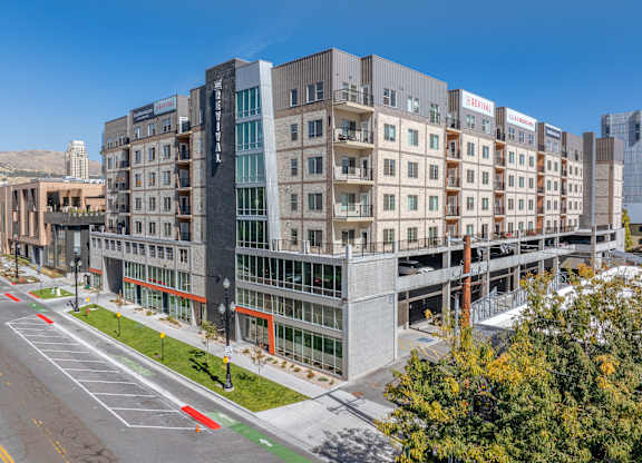 a large building with many windows and a street in front of it at The Revival, Salt Lake City, UT, 84101