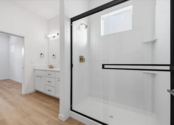 Bathroom with glass separated shower at Alante Homes at Spring Run, Caldwell, Idaho