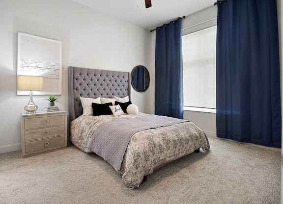 a bedroom with a bed and a dresser at 200 City View, Provo, 84601