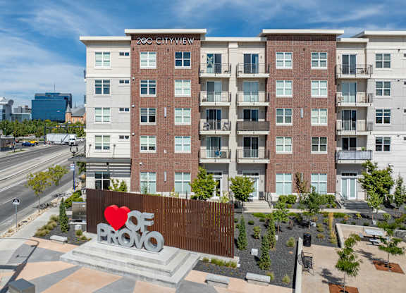 a large sign in front of a building with a red heart on it at 200 City View, Provo, Utah