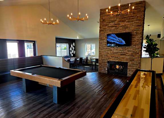 Game room with a pool table and a fireplace at Avia Lofts at Maple Road, Amherst, NY, New York, 14221