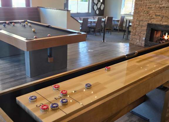 Warm Fireplace with pool table at Avia Lofts at Maple Road, Amherst, NY
