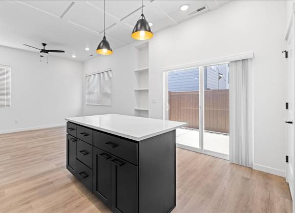 Kitchen with white counter at Alante Homes at Spring Run, Caldwell, 83607
