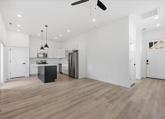 Spacious room with kitchen view at Alante Homes at Spring Run, Caldwell, ID, 83607