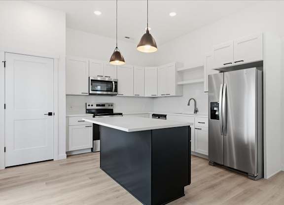 Modern kitchen with white countertop at Alante Homes at Spring Run, Idaho