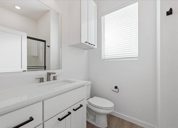 Bathroom with toilet and mirror at Alante Homes at Spring Run, Idaho