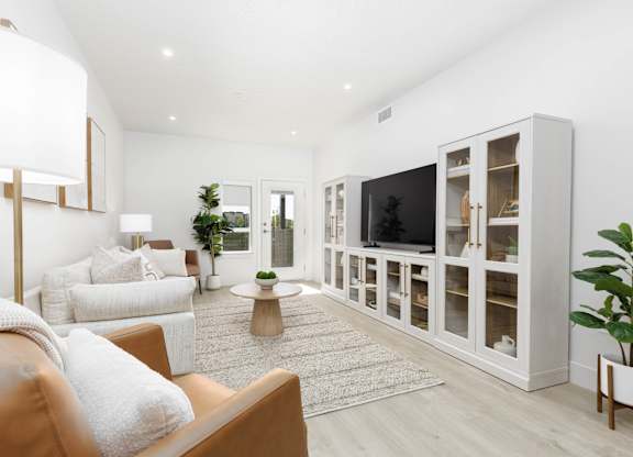 Modern living room with TV at The Vue At Desert Color, St. George, Utah