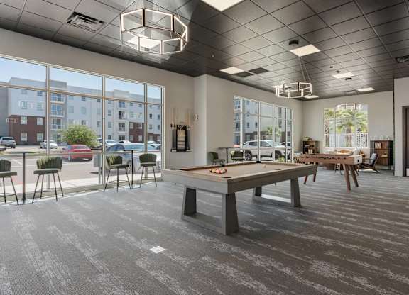 a communal area with a pool table in a tenants clubhouse at 605 Place Student Housing & Co-Living, Utah, 84770