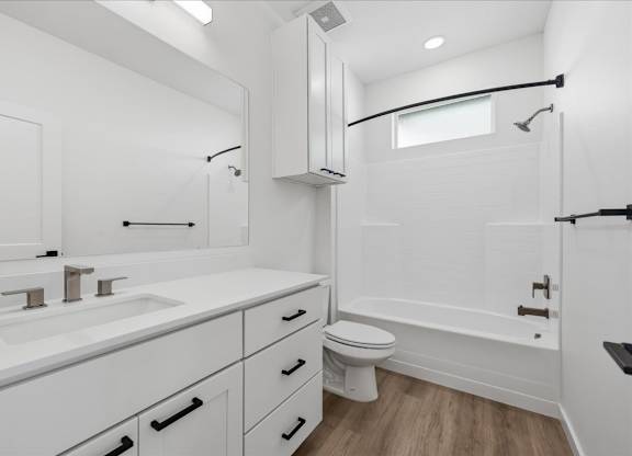 Bathroom with a sink, toilet, and bathtub at Alante Homes at Spring Run, Caldwell, ID, 83607