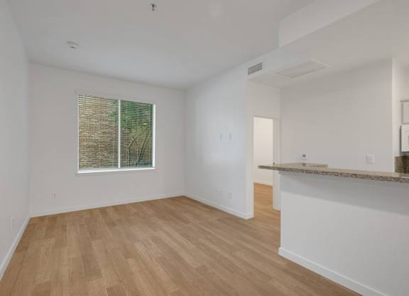 Unfurnished room with window at AVIA Apartments On Alpha, Dallas, TX