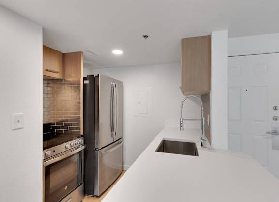 Fridge in kitchen at AVIA Apartments On Alpha, Dallas, TX, 75240
