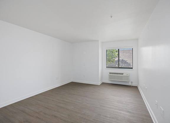 Bedroom with ac unit at Avia Apartments on College Blvd (Overland Park), Overland Park