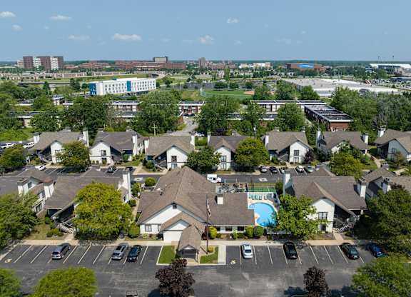 an aerial view of a neighborhood with houses and a swimming pool at Avia Lofts at Maple Road, New York
