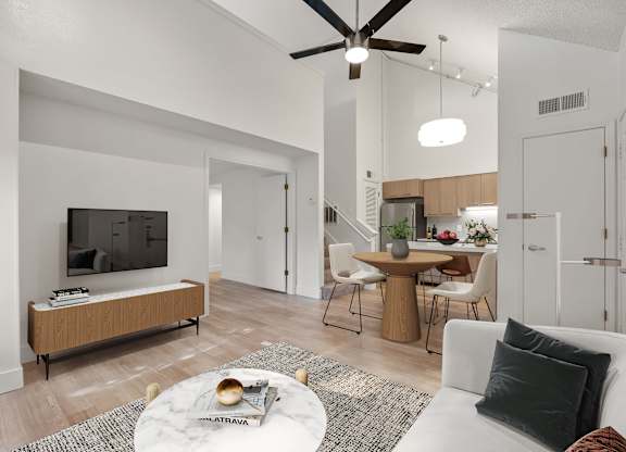 a living room with a couch and a table and a tv at AVIA Lofts on Parkway Apartments, Vancouver, WA, 98662