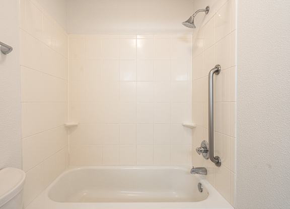 Bathroom with a bathtub at AVIA Lofts on Victors Way, Michigan