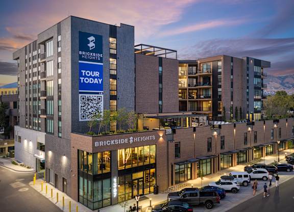 A modern building with a sign that says Brickside Heights.