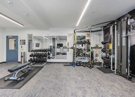 the preserve at ballantyne commons fitness room with weights and cardio equipment at The Flats at Riverwoods, Provo, Utah