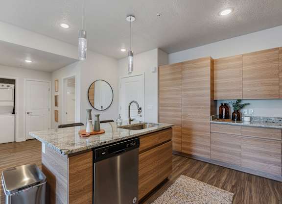 modern kitchen with stainless steel appliances at The Flats at Riverwoods, Provo
