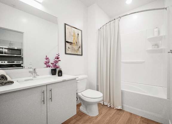 a bathroom with a shower and a sink and a toilet  at SevenO2 Main Apartments, Salt Lake City
