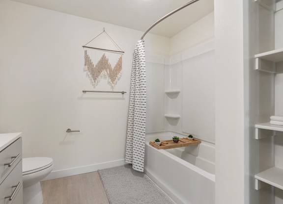 a bathroom with a shower and a toilet and a sink at Paperbox Lofts, Salt Lake City, UT