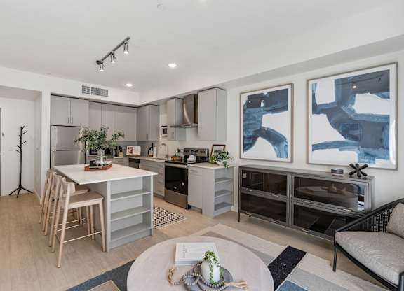 a living room with a kitchen and a dining table at Paperbox Lofts, Utah, 84101