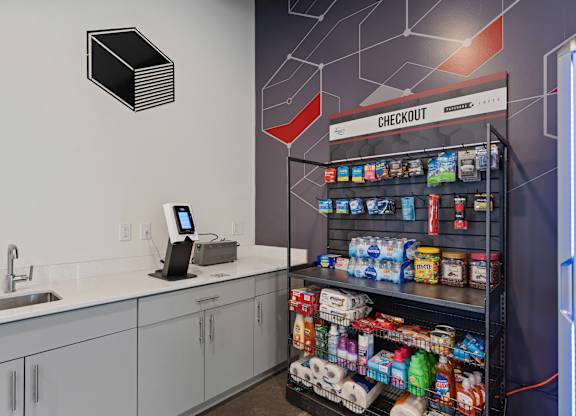 A modern kitchen with a check out counter.