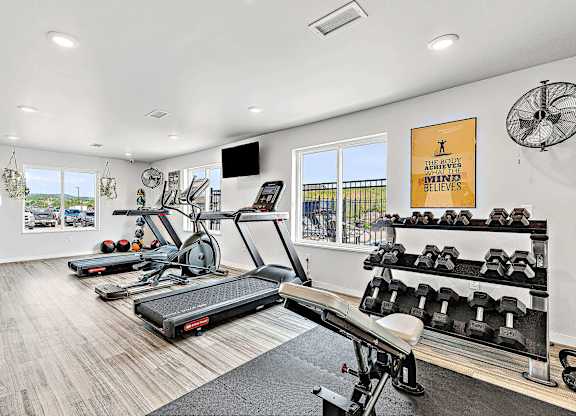 a workout room with treadmills and other exercise equipment at Red Rock Apartments, South Dakota 57702