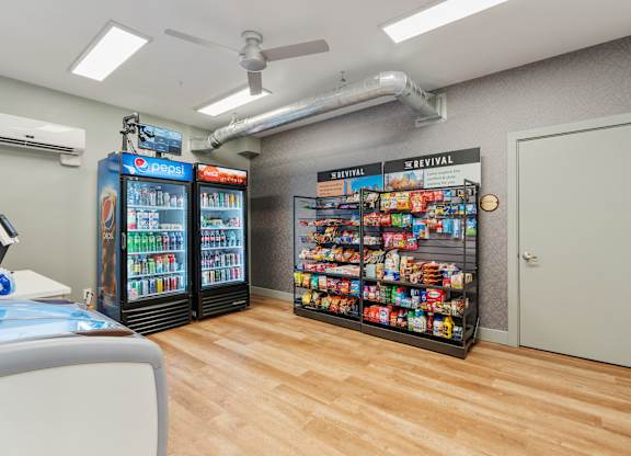 a convenience store with vending machines and a wood floor at The Revival, Utah