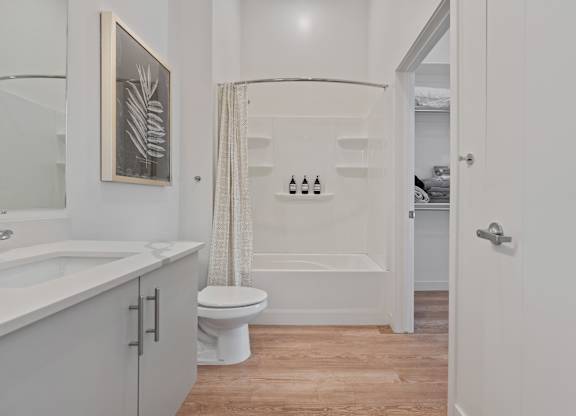 a bathroom with a shower and a toilet and a sink at SevenO2 Main Apartments, Utah, 84101