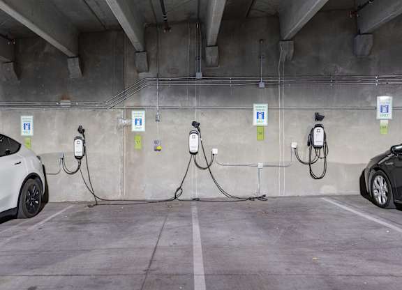 an electric car charging in a parking garage at SevenO2 Main Apartments, Utah