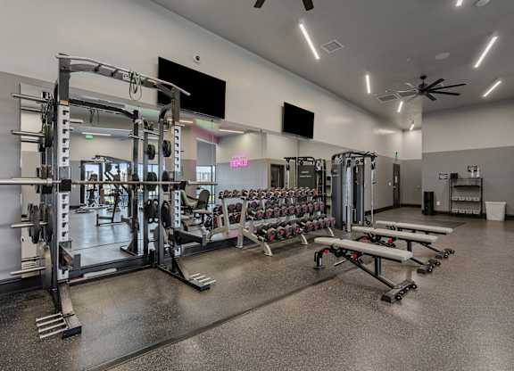 a gym with weights and dumbbells and other exercise equipment at SevenO2 Main Apartments, Salt Lake City, 84101