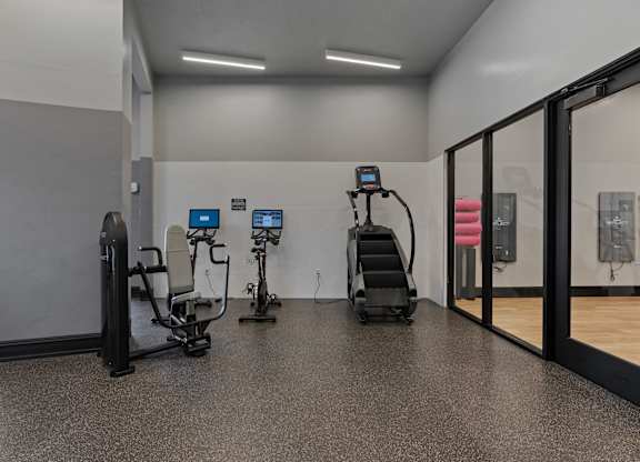 a gym with weights and cardio equipment in a building at SevenO2 Main Apartments, Salt Lake City, UT