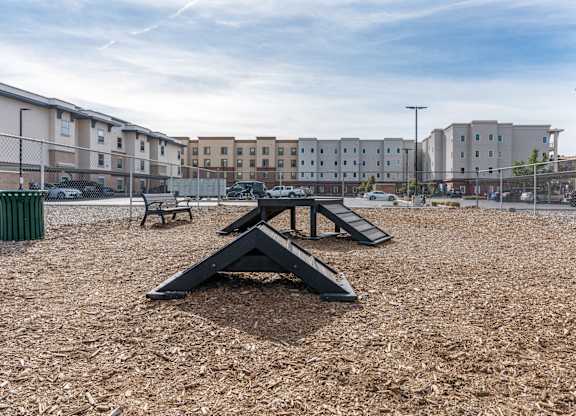 a playground with a ramp and a picnic table in a parkat The View on 20th, Ogden, UT, 84401
