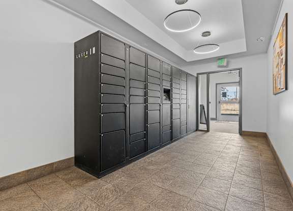 a long hallway with black lockers and a corridor with a doorat The View on 20th, Ogden, UT, 84401