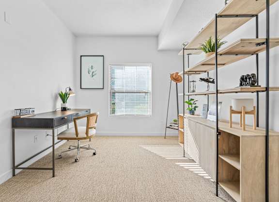 a home office with a desk and shelves and a windowat The View on 20th, Utah