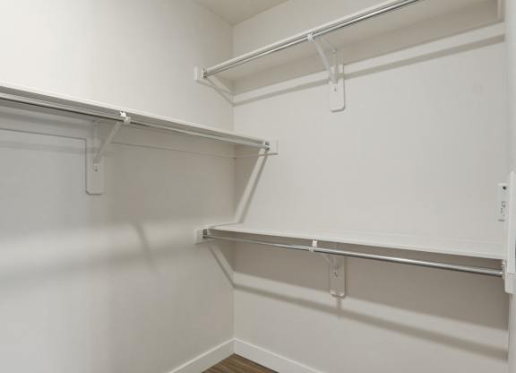 a spacious walk in closet in a 555 waverly unit at The Flats at Riverwoods, Utah