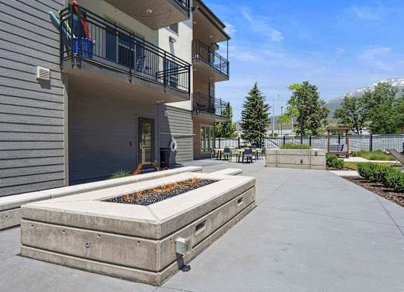 the courtyard at the whispering winds apartments in pearland, tx at The Flats at Riverwoods, Utah