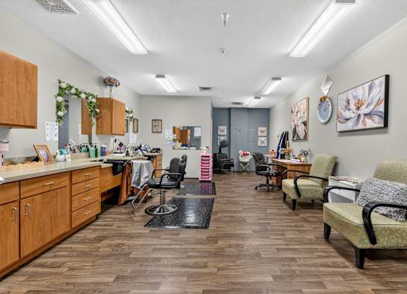 A room with wooden floors and furniture.