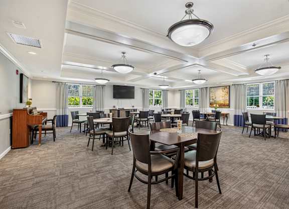 A large conference room with a long table and chairs.