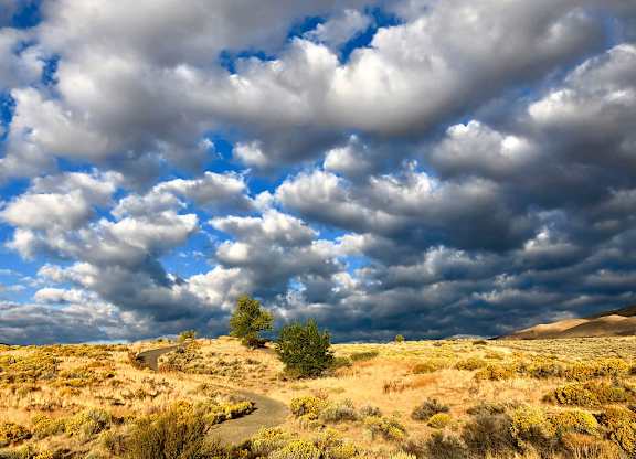 Desert landscape with dramatic cloudy sky at Lakeside Manor Apartments, Reno