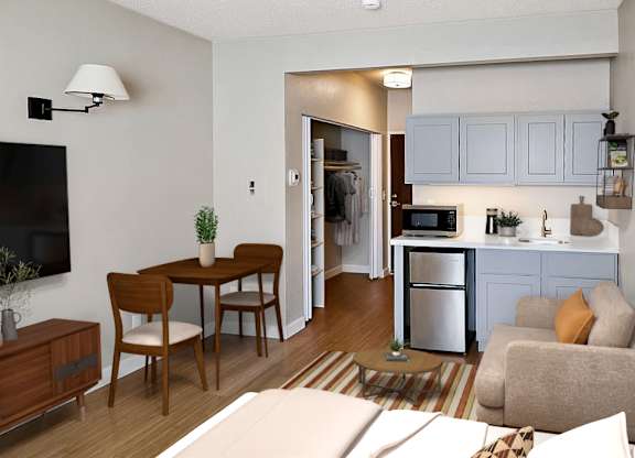 Studio apartment with compact kitchen and seating at Lakeside Manor Apartments, Reno, NV 89509