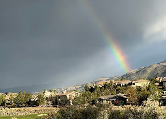Rainbow over residential community and hillside at Lakeside Manor Apartments, Reno, 89509