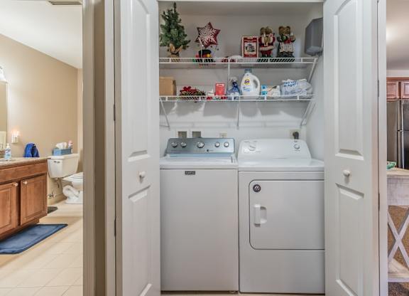 In unit laundry closet with washer and dryer at Schuyler Commons Apartments, Utica, New York