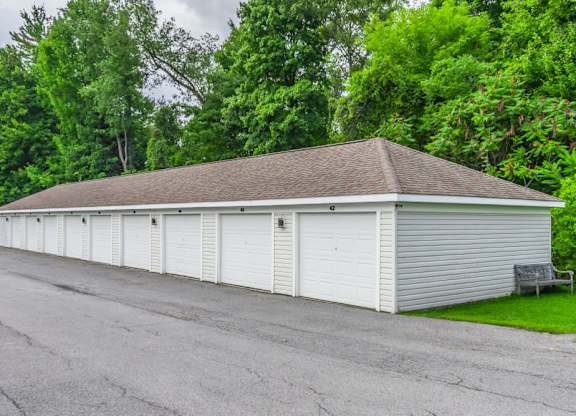 Row of white storage garages at Schuyler Commons Apartments, Utica, NY
