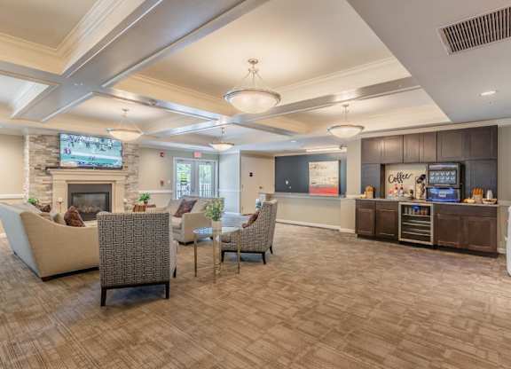 Clubhouse with kitchen area and comfortable seating at Glenmont Abbey Village, 55+ Apartments, Glenmont, New Jersey