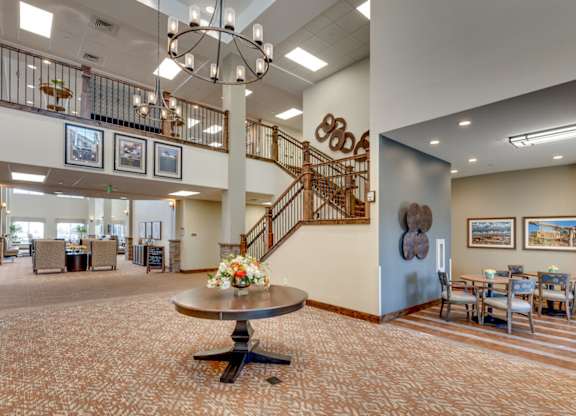 Grand lobby with chandelier and staircase at Mountain Lakes Estates Apartments, Nevada