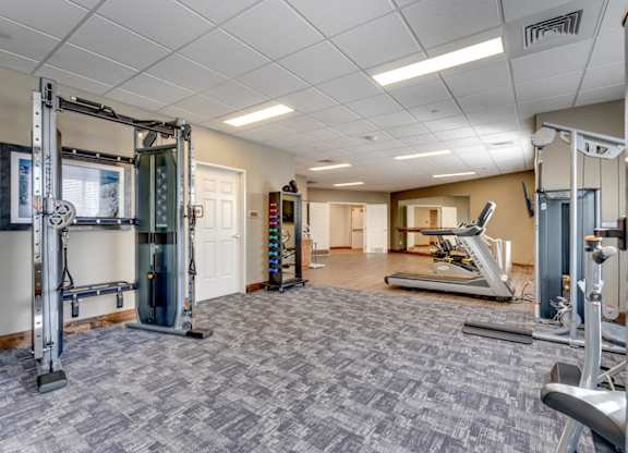 Fitness center with cable machines and cardio equipment at Mountain Lakes Estates Apartments, Reno, NV 89521