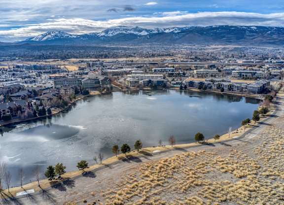 Aerial view of residential development with frozen lake at Mountain Lakes Estates Apartments, Nevada, 89521